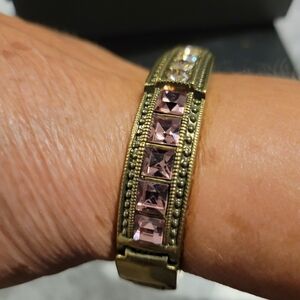 HEIDI DAUS RETIRED COLECTION, BEAUTIFUL BRONZ, AND CRYSTAL HINGED BRACELET.